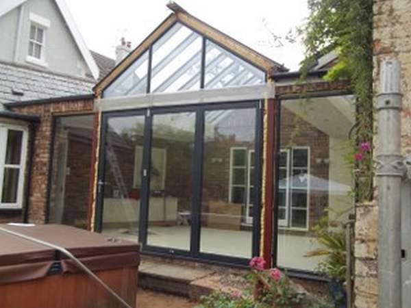 Mr & Mrs E, West Kirby, Wirral : Centor C1 double glazed Bi-fold doors with marine finish. With a combination Allstyle gable ended double glazed point. Aluminium spared ATS roof system with double glazed celsius glass.